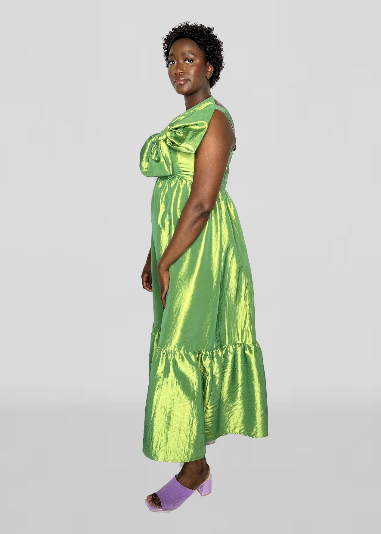 Long asymmetrical green dress with detail